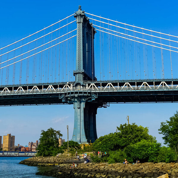 The Manhattan Bridge is a suspension bridge that crosses the East River in New York City, connecting Lower Manhattan at Canal Street with Downtown Brooklyn