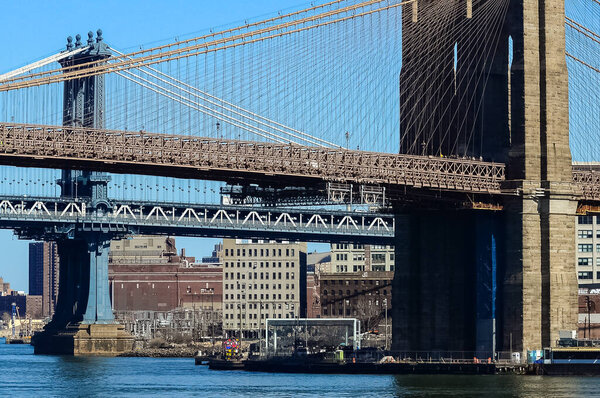 The Brooklyn Bridge is a bridge in New York City, spanning the East River between the boroughs of Manhattan and Brooklyn.