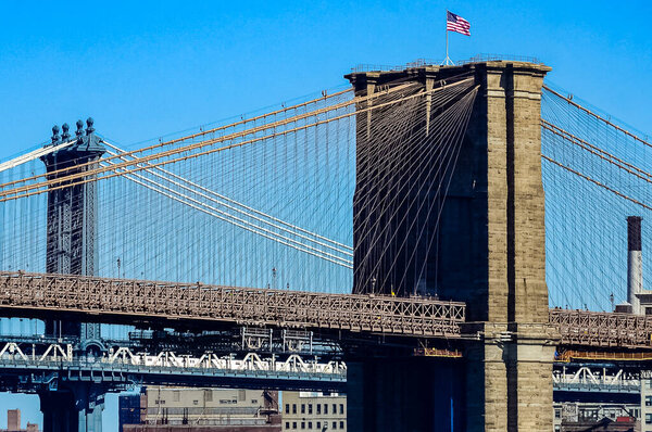 The Brooklyn Bridge is a bridge in New York City, spanning the East River between the boroughs of Manhattan and Brooklyn.