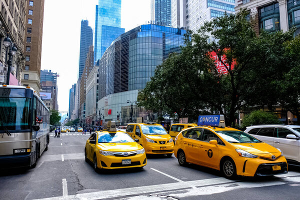 New York City Manhattan street panorama with yellow New York City taxi cabs on the streets. Manhattan, New York.