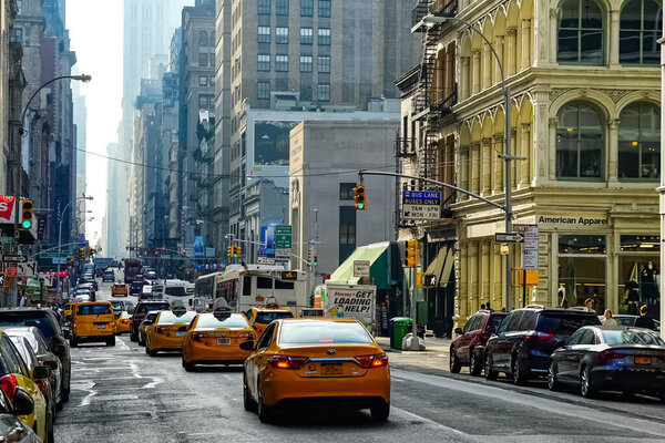 Broadway in New York City with yellow New York City taxi cabs on the streets. Manhattan, New York.