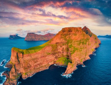 View from flying drone. Incredible sunset on Kallur Lighthouse, Kalsoy island. Unbelievable summer scene of Faroe Islands, Kingdom of Denmark, Europe. Fantastic evening seascape of Atlantic ocean clipart