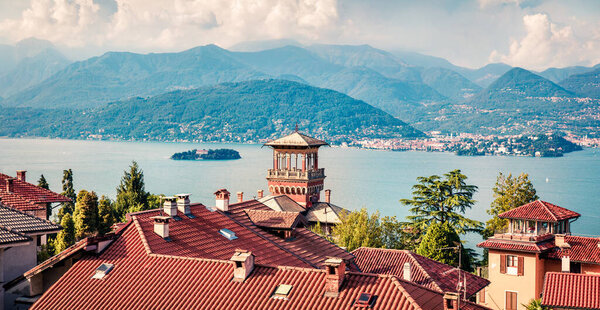 Sunny morning cityscape of Stresa town. Panoramic summer view of Maggiore lake with Mottarone mountain on background, Italy, Europe.