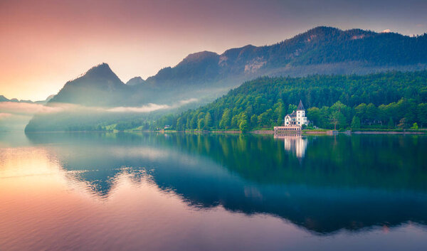 Impressive sunrise of Grundlsee lake. Beautiful summer view of Gessl village, Liezen District of Styria, Austria, Alps. Europe. Beauty of countryside concept background
