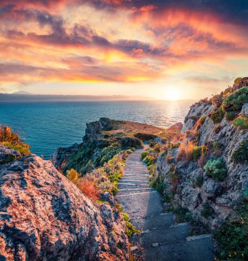 Sunrise time. Superb spring view of Milazzo cape. Colorful morning scene of Sicily, Italy, Europe. Amazing seascape of Mediterranean sea. Beauty of nature concept background. clipart