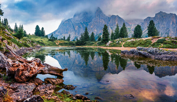 Dramatic morning view of Limides lake. Unbelievable summer sunrise on Dolomiti Alps, Cortina d'Ampezzo, Falzarego pass, Italy, Europe. Beauty of nature concept background.
