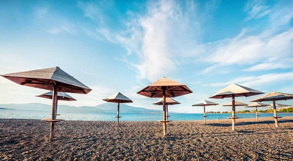 First April warm days on the Nafpaktos beach. Sunny spring seascape of Corinth Gulf. Splendid morning panorama of Greece resort. Vacation concept background.