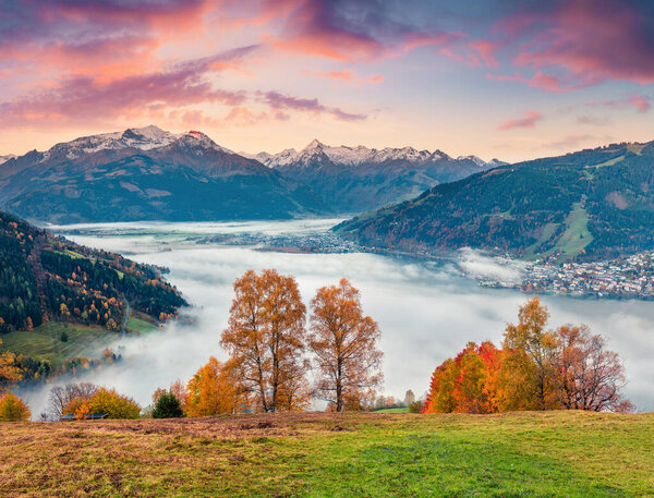 Fantastic view of Zell lake. Impressive autumn view of Austrian town - Zell am See, south of the city of Salzburg. Beauty of nature concept background