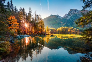 Majestic autumn view of Hintersee lake with Hochkalter peak on background, Germany, Europe. Gorgeous morning view of Bavarian Alps. Beauty of nature concept background. clipart