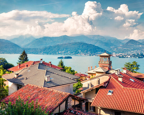 Sunny morning cityscape of Stresa town. Colorful summer view of Maggiore lake with Mottarone mountain on background, Italy, Europe.