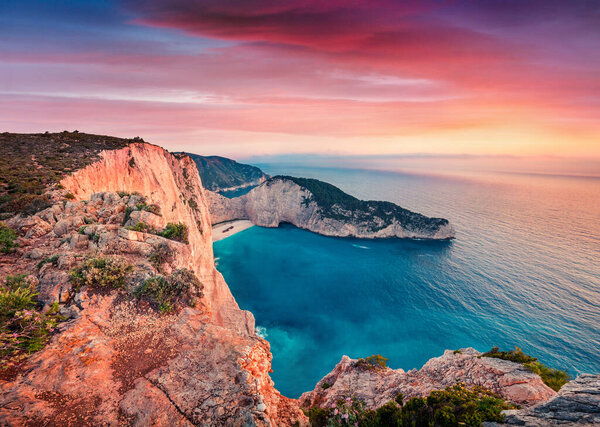 Dramatic spring scene on the Shipwreck Beach. Colorful sunset on the Ionian Sea, Zakinthos island, Greece, Europe. Beauty of nature concept background. Artistic style post processed photo