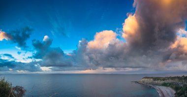 Evening cloudscape on the Milazzo cape clipart
