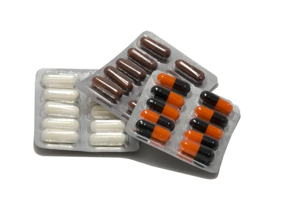 Три різні пакувальні таблетки — стокове фото