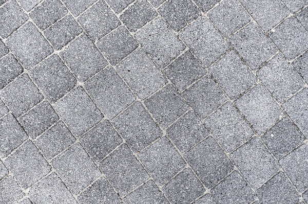 Road tiles as background. Granite tiles