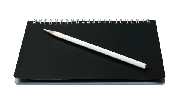 Открыть тетрадь карандашом — стоковое фото