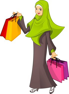 Yeşil peçe giyen bir alışveriş çantası tutan Müslüman kadın