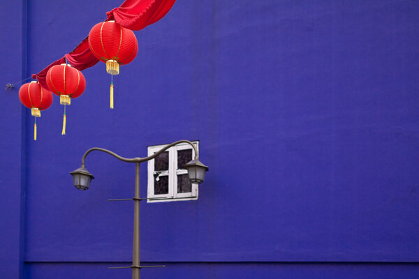 Three red lanterns against wall