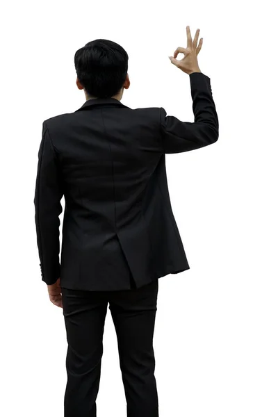 stock image Rear view of a male businessman lifting a hand sign OK