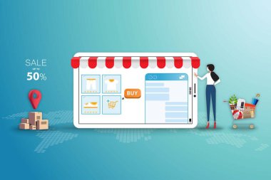 Çevrimiçi alışveriş kavramına göre, genç kadınlar yüz maskesi takar ve müşteri hizmetleriyle sohbet etmek için büyük bir tablet ekrana dokunarak uygulamadan yeşil renkli ürünleri sipariş ederler..