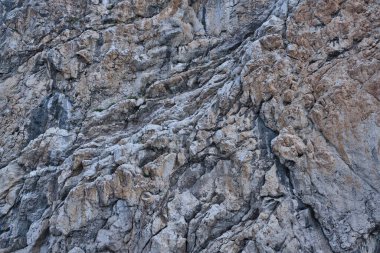 Arkaplan olarak gri kahverengi renkli kayanın dokusu