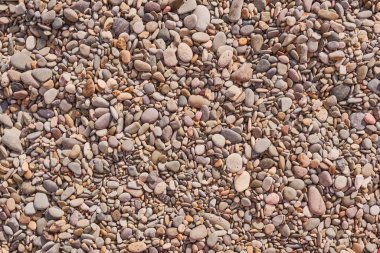 Arkaplan olarak renkli çakıl taşı plajının dokusu