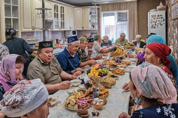 Residents of a Siberian village celebrate the Muslim holiday Kurban Bayram at their home table. Eid al-Adha, the festival of sacrifice. — Stock Photo, Image