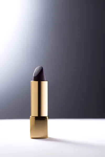 Lipstick on grey background — Stock Photo, Image