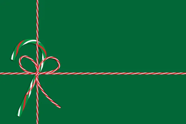 Decoração de Natal com cana-de-açúcar verde, arco vermelho e amarelo, fita. Um presente de Natal. Ilustração vetorial. Imagem de stock. — Vetor de Stock