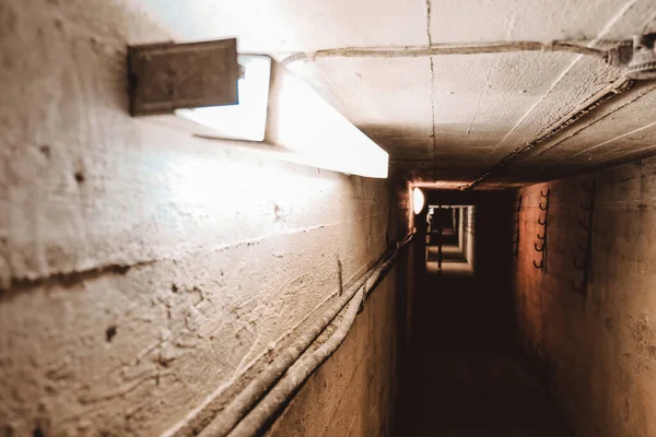 Dark corridor of old abandoned Soviet underground bunker. Defocused