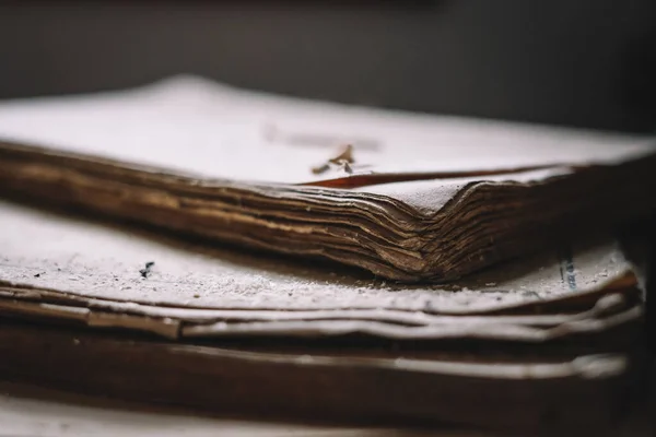 Old books covered with dust. Selective focus