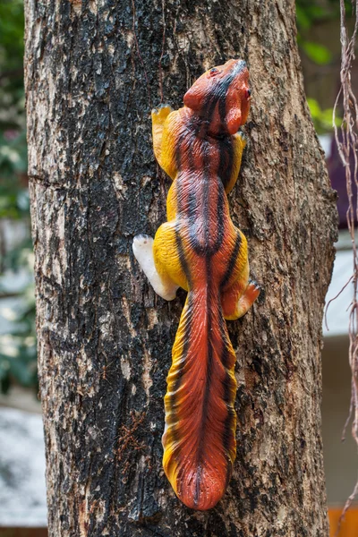 Squirrel doll on a tree — Stock Photo, Image