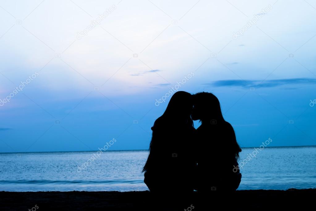 Female homosexuals in love beside sea