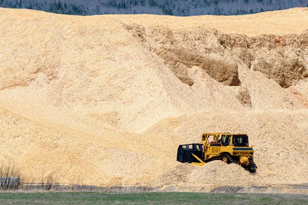 Unmarked Yellow Bulldozer Bottom Huge Pile Sawdust Pile Much Taller Royalty Free Stock Photos