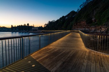 The new Terrigal Boardwalk opened on 14 April 2021 and provides accessible pedestrian access around the headland between the Terrigal Beach and The Haven. clipart