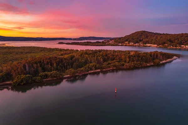 stock image Colourful high cloud sunset waterscape with boats at Woy Woy, NSW, Australia.