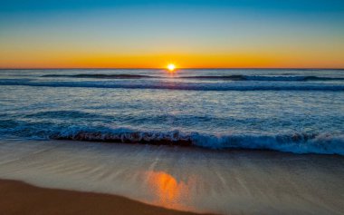 Aerial sunrise seascape from Whale Beach on the Northern Beaches of Sydney, NSW, Australia.