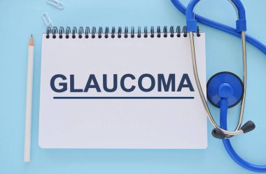 GLAUCOMA word written in Notebook. GLAUCOMA text on light bluebckground for your desing, concept