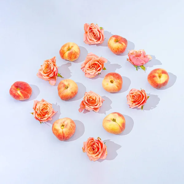 Lovely Pattern Made Peaches Roses Pastel Blue Background Summer Fruits — Stock Photo, Image