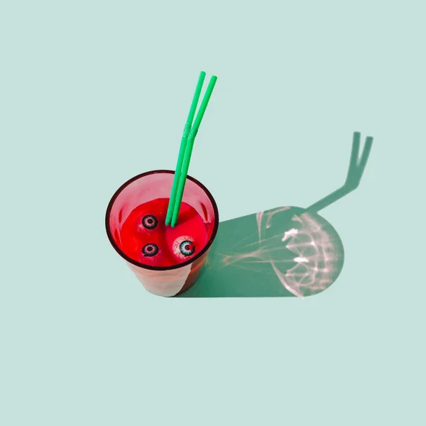 Glass Filled Red Drink Eye Balls Liquid Two Green Straws — Stock Photo, Image