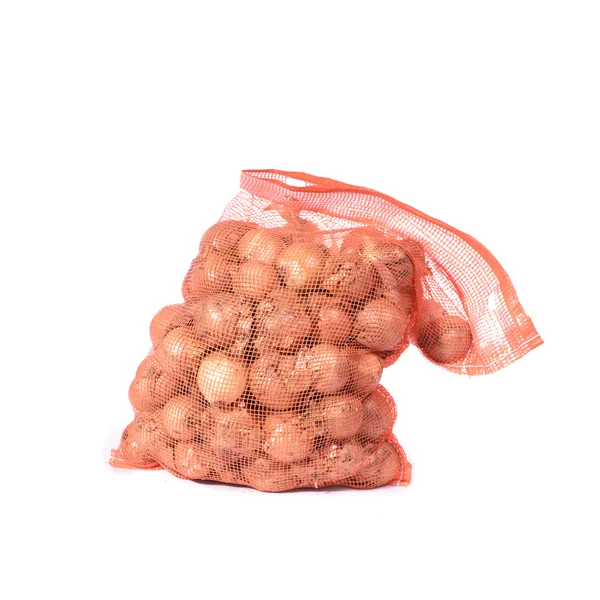 Cipolle in sacchetto di rete — Foto Stock