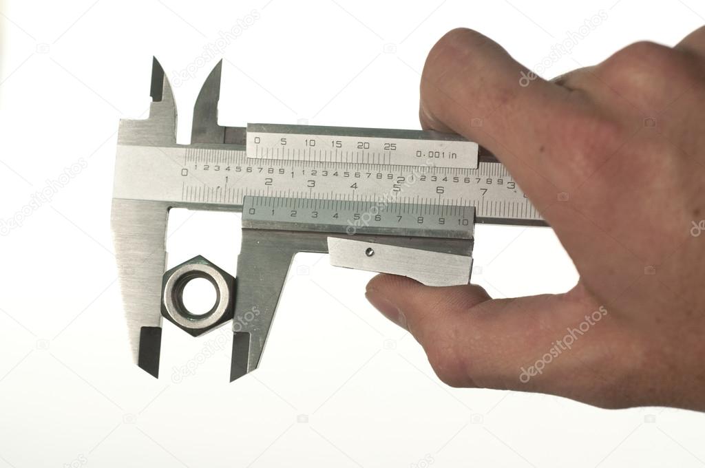Technician hand measuring nut with caliper isolated on white