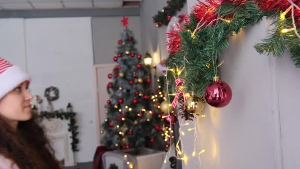 Young Beautiful Woman Santa Hat Decorating Christmas Tree Home — Stock Video