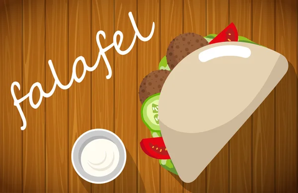Falafel pide üzerinde ahşap masa ile tabak.