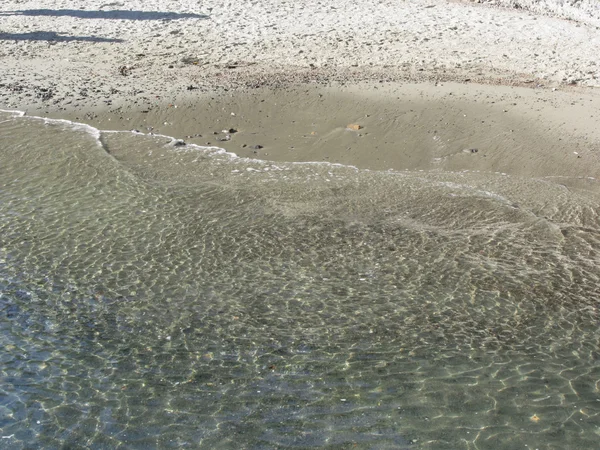 Welle des Meeres auf dem Sandstrand. portovenere, provinz la spezia, italien — Stockfoto