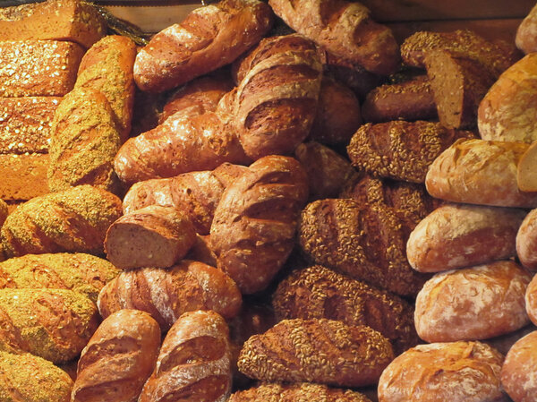 Many mixed breads and rolls background