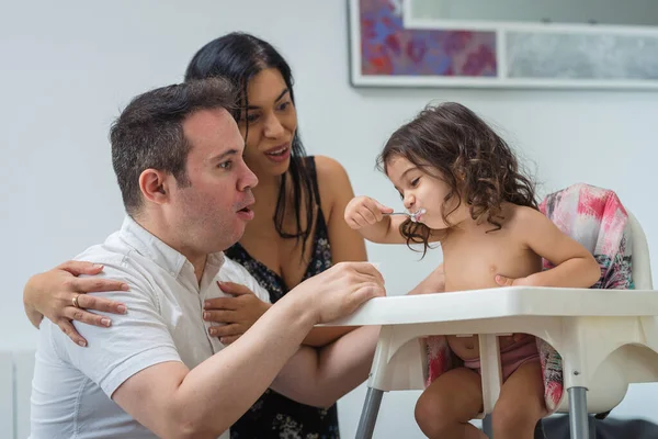 Smiling Ethnic Hispanic Mother Caucasian Father Feeds Yogurt Two Year — Stock Photo, Image