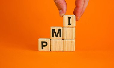 Wood cubes with acronym 'PMI' - 'Purchasing Managers Index' stacking as step stair on orange background, copy space. Male hand. Business concept. clipart