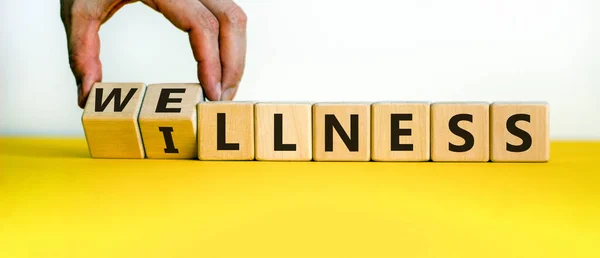 Male Hand Flips Wooden Cubes Changes Inscription Wellness Illness Vice — Stock Photo, Image