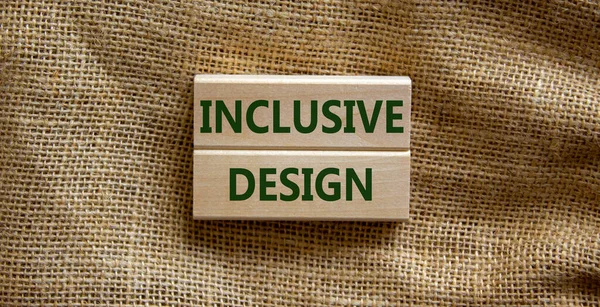 Inclusive design symbol. Wooden blocks form the words \'inclusive design\' on beautiful canvas background. Inclusive design Concept. Copy space.