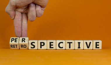 Perspective or retrospective symbol. Businessman hand turns cubes and changes word 'retrospective' to 'perspective'. Beautiful white background. Business and perspective concept. Copy space. clipart